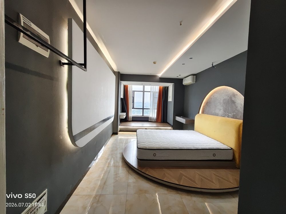 Penli Plaza rental apartment — bedroom to living area